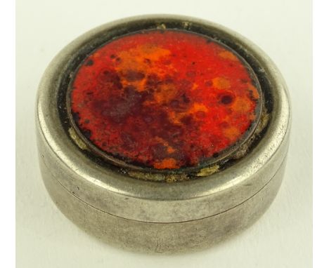 A small circular silver and enamel pill box, 3.5cm diameter.