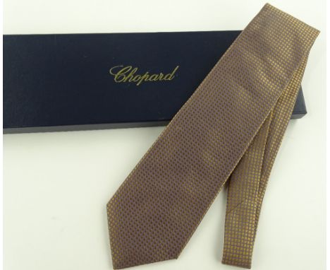 A Chopard gold silk tie, new, boxed with certificate.