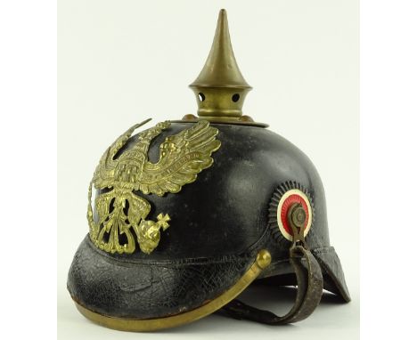 A German Army pickel haube helmet, brass mounted on leather.