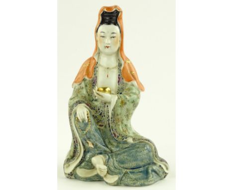 A Chinese porcelain figure of Guanyin, painted enamel decoration, height 21cm.