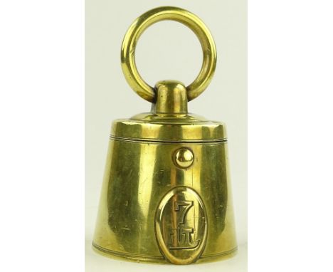 A Victorian novelty brass inkwell in the form of a 7lb weight, height 9cm.