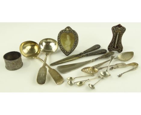 A group of silver items, including silver mounted desk thermometer, pair of sauce ladles, photo frame, etc.