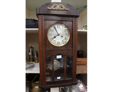 A 1930s mahogany wall clock with Arabic numerals to dial 