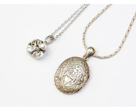 Two silver pendants and chain to include a locket and paste set 