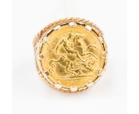 A George V 1915 half Sovereign ring, encased in 9ct,  size Q, weight approx 12.00 grams 