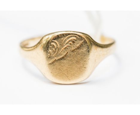 A 9ct gold signet ring, cushion shape, with engraved pattern, size X1/2, weight approx 3.5 grams 