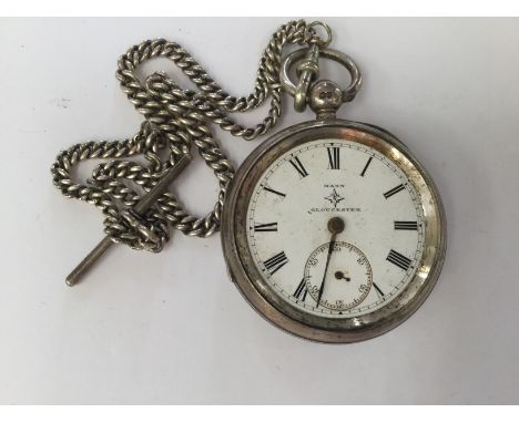 A Mann of Gloucester silver cased pocket watch and Albert chain, watch glass needs replacing, London 1882, total gross weight