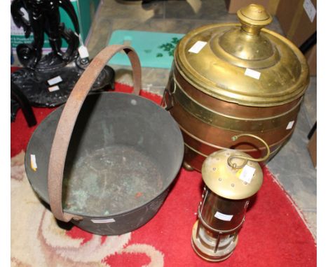 A copper and brass coal bucket, together with a miners lamp marked E. Thomas & Williams No. 149023 and a brass jam pan (3)