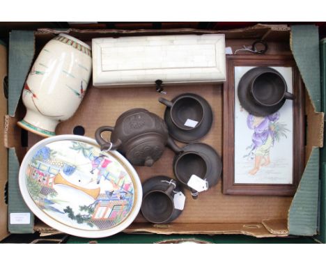 A Chinese teapot with four cups and saucers, circa 1940 Yixing 