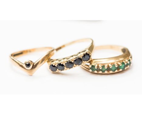 Three 9ct gold stone, comprising two half eternity style rings one set with emeralds the other with sapphire and a sapphire w