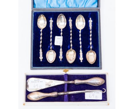 A cased set of six silver Apostle teaspoons, Birmingham 1897/8 weight approx 1.8ozt, together with a silver handled button ho
