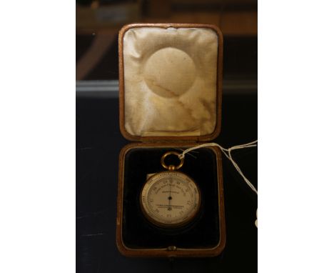A Thomas Armstrong and Brother Pocket barometer, gilt case, complete with travelling case