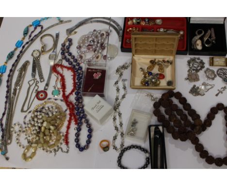 A large quantity of assorted vintage jewellery to include silver, bead set, etc 