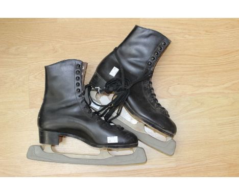 One pair of mens skating boots, leather button studs 1930's and a pair of cricket pads 1930's (2)