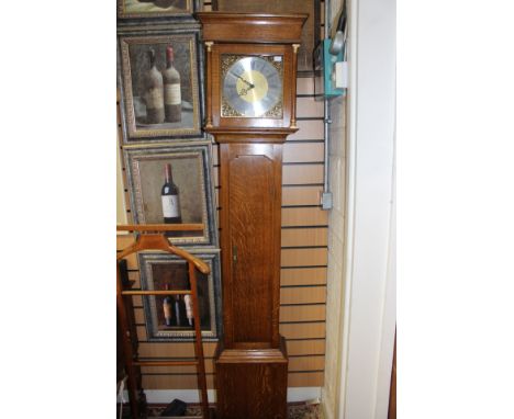 A modern oak cased longcase clock, with a silvered dial