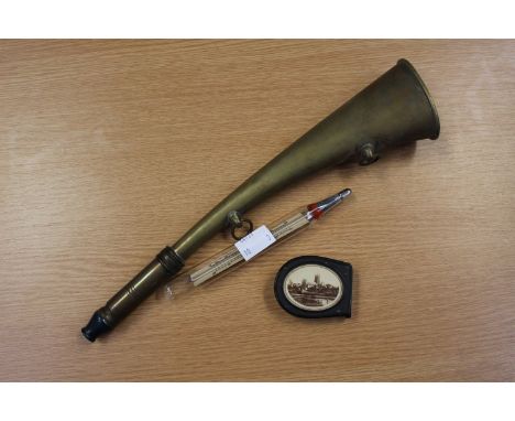 A Bakelite vesta with image of Worcester Cathedral; together with a brass LMS horn and a hydrometer (3) 