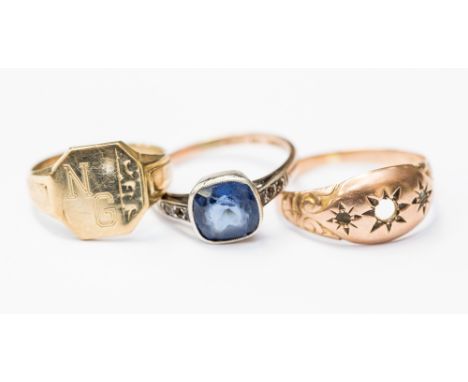 A group of three rings comprising a 9ct gold signet ring, a rose gold gypsy set ring mount (stones missing) and a blue stone 