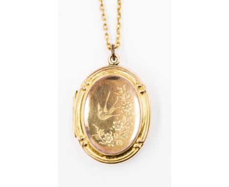 A 9ct gold crucifix with a 9ct gold locket on a chain, total weight approx 6.4 grams 