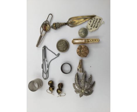 A 9ct gold fronted collar stud, a Victorian brass book mark, an AFS button, L.M.S. uniform button, tie clips to include Strat