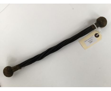 An early 19th century whalebone, double ended cosh or reprimand 'bong' stick, the ends have knotted twine over metal 