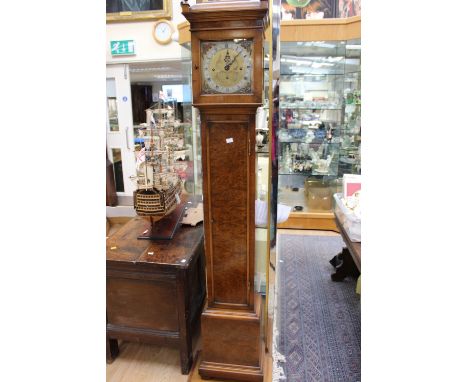 A Queen Anne style walnut eight day Grandmother clock, having three winder holes, raised on an oak plinth (2)