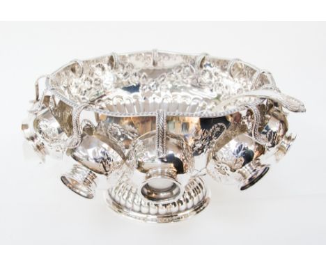 A silver plated punch bowl, cups and ladle