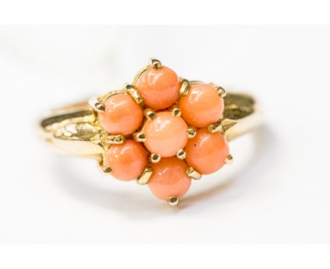 An angel coral cluster ring, claw set flower design in 9ct gold, size N, with a total gross weight of approx 3.3gms