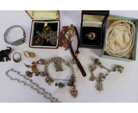 A circa 1930's 9ct rose gold lady's wristwatch with Arabic numerals, a 9ct watch strap, silver charm bracelets with padlock  