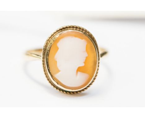 A yellow metal cameo ring, probably 9ct gold, size O, with a total gross weight of approx 2gms