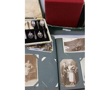 A photograph/postcard album, with a wall barometer and assorted cased EPNS flatware 