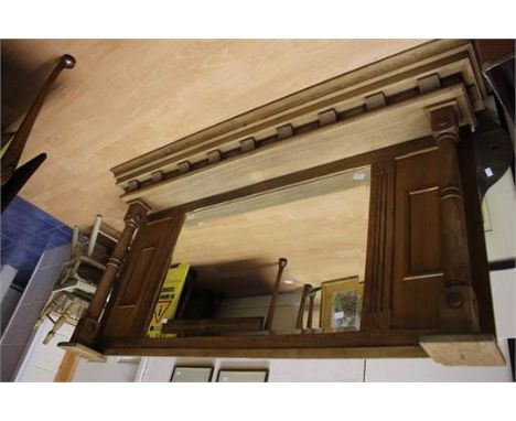 A late 20th Century solid oak over mantle mirror, hand crafted, fitted with bevelled edge glass