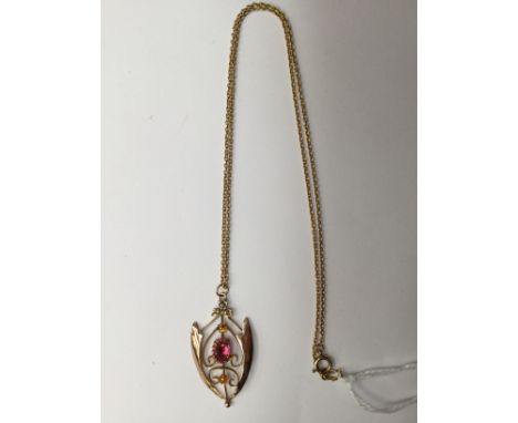 A late Victorian 9ct gold pendant set with a pink stone and seed pearls; together with a replaced 9ct gold chain, total gross