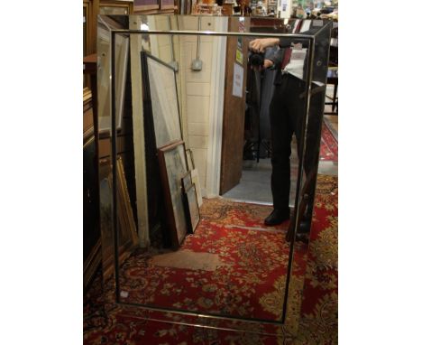 A large rectangular mirror segmented to form a mirrored frame, 70cm by 106cm