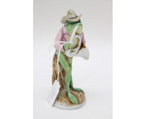 Porcelain figure of a frog playing a French Horn