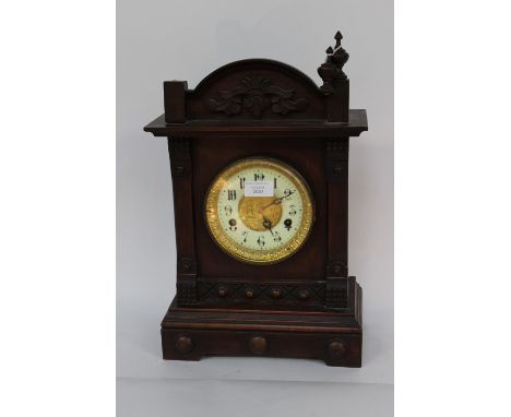 An Edwardian mantle clock manufactured by the United Clock Co, Birmingham, striking/pendulum, enamel dial with Germanic numer