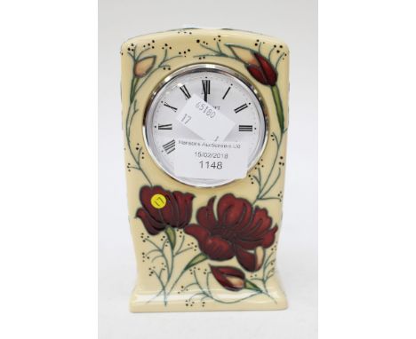 A Moorcroft mantle clock in the 'Chocolate Cosmos' pattern, designed by Rachel Bishop, dated to the base 2013, first quality 