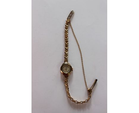 A ladies vintage 9ct gold Bentima watch,round dial, approx case diameter 15mm on a 9ct gold cross link strap, total gross wei