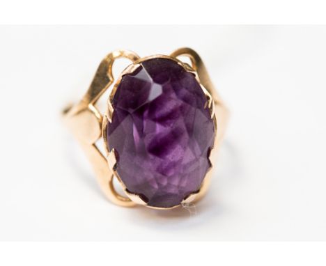 A large amethyst dress ring, with an ornate rose gold mount, (continental) the amethyst size approx 17mm x 12mm, , size S, wi