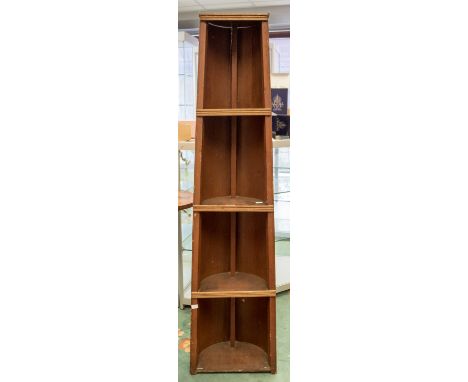 A boat shaped four shelf shelving unit