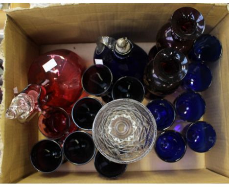 A Bristol Blue decanter, having twisted glass handle and EPNS stopper, with Cranberry glass decanter and stopper, etc 