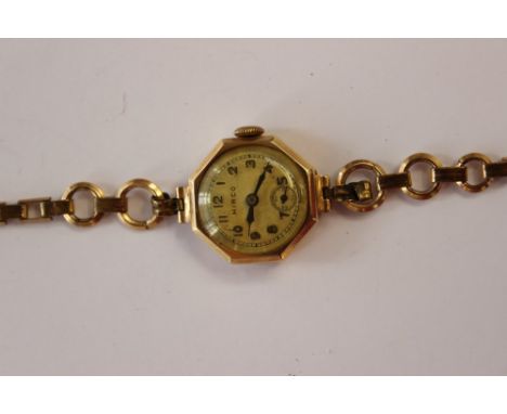 A ladies vintage circa 1930's Hirco 9ct gold watch, octagonal dial, numbers and blue hands on a rolled gold bracelet, total g