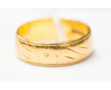 A 22ct gold patterned wedding band, 6mm wide, size R, weight approx 7.4gms 