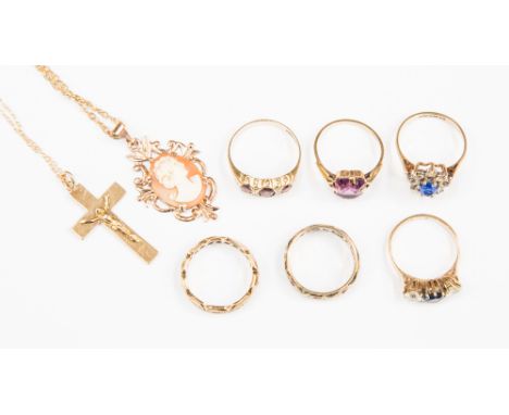 A 9ct gold crucifix, a cameo pendant stamped 9ct, 9ct three stone garnet ring and five others with a total combined gross wei