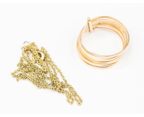 A multi band ring made up of  seven hammer finish bands, size S, possibly 14k and a fine yellow metal chain possibly 14k, len