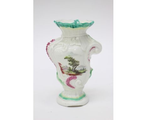 A Derby porcelain Rococo scroll moulded vase, circa 1760, asymmetrical, each side with a painted landscape. patch marks, 14cm