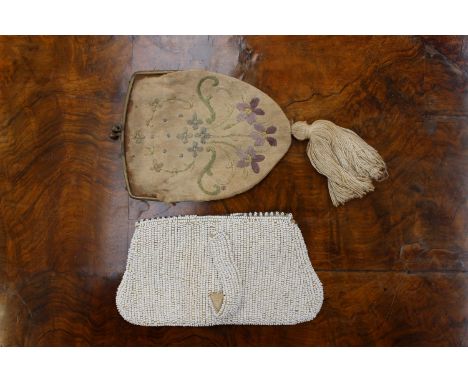 A bugle beadwork, 1930's purse with pearl fastener together with an early Edwardian embroidered purse with tassle detail (2)