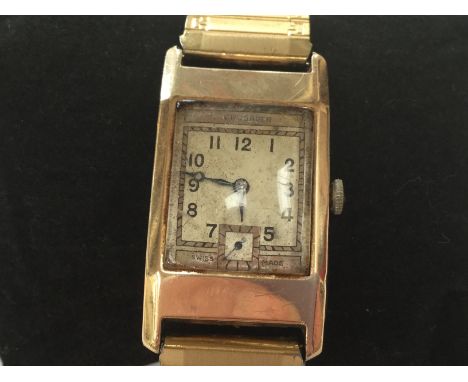 A 1930's yellow metal cased tank watch, probably 9ct gold 'Crusader' with am elongated rectangular dial and case, approx diam