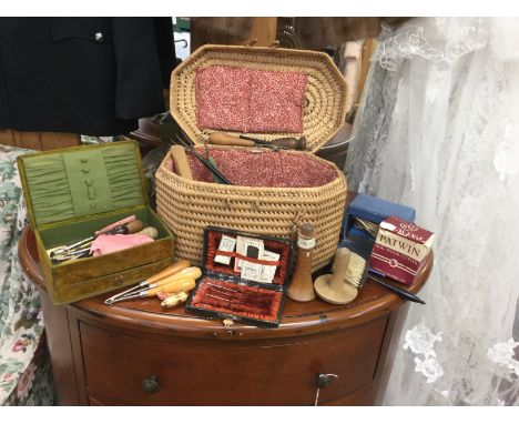 Needle cases, bobbin case, needle box and Victorian workbox and contents, treen, bone items, all within a woven basket includ