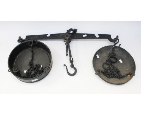 A Smiths cast iron farmers scales, having two pans and chains, no weights 