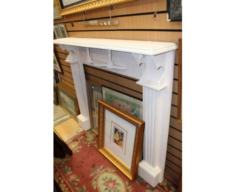 A Victorian white fire surround, the centre with a mantle shelf, fluted pillasters